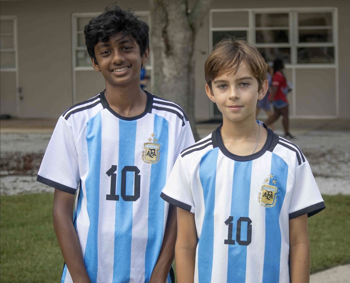 7th grader Arjun Chandru and 6th grader Crosby Clemente pose in their Argentinian Messi jerseys for Hoco Spirit Day 1. Messis global influence had Trinity Students decked out in blue and white for Jersey Day. 